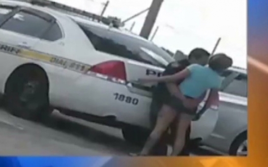 Cop In Hot Water Over Photo With Woman On Lap - VIDEO