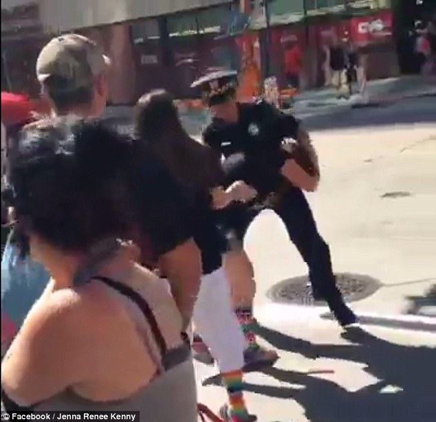 Cop investigated after being caught on camera 'grabbing a woman - PHOTO+VIDEO