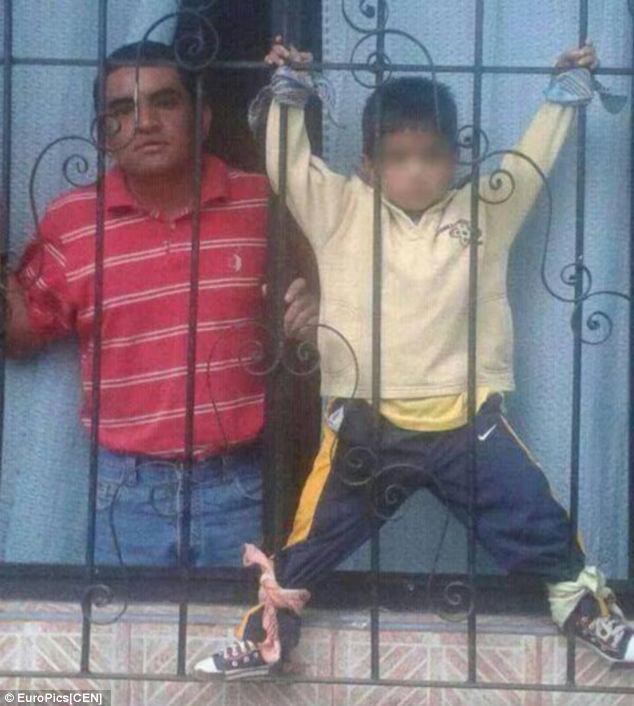 Mother chains her four-year-old son to iron railings - PHOTO