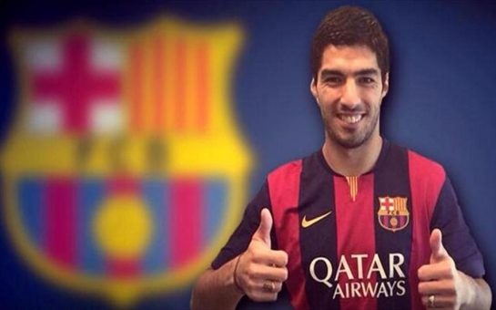 Suarez touches down in Spain to sign Barcelona deal