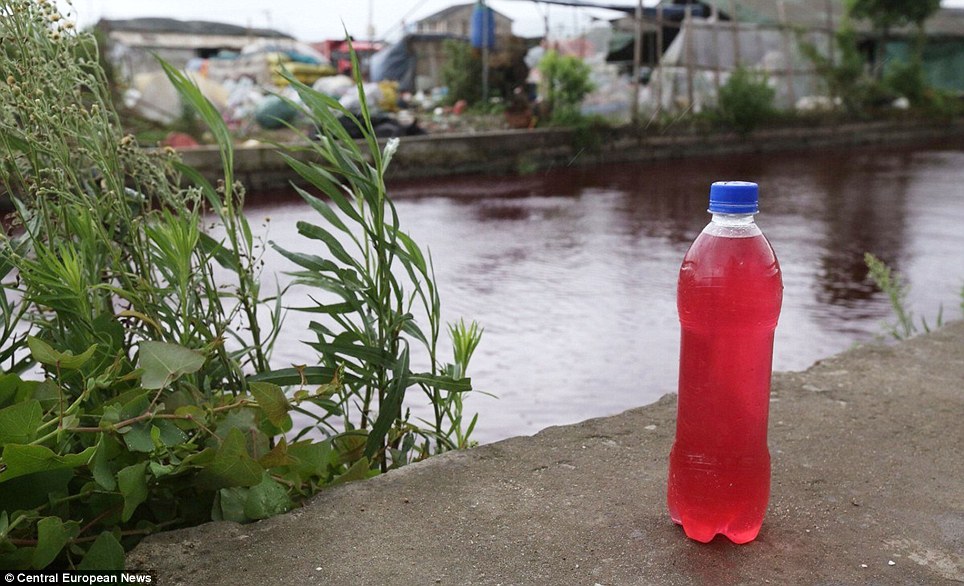 Villagers baffled as river suddenly turns colour of blood overnight - PHOTO