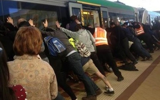 Passengers tilt train carriage to free man trapped in the gap