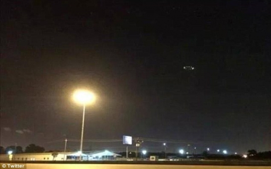 UFO photographed hovering above city's stormy skies - PHOTO+VIDEO