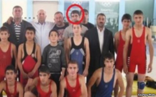 Why did an Azerbaijani wrestling champion join IS?