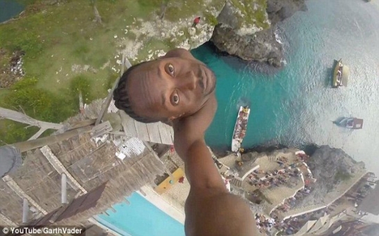 Video shows brave Jamaican make extreme dive off 100ft cliff - VIDEO
