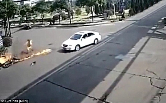 Motorbike rider is turned into human fireball after hitting car... and SURVIVES - VIDEO