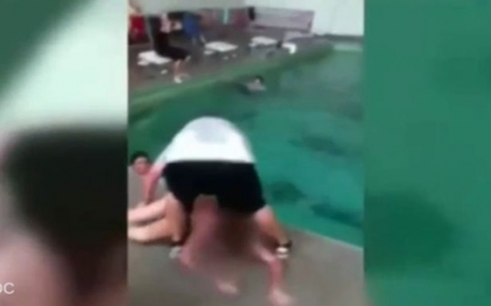 Teacher dragging girl, 14, into pool after she refused to swim - VIDEO