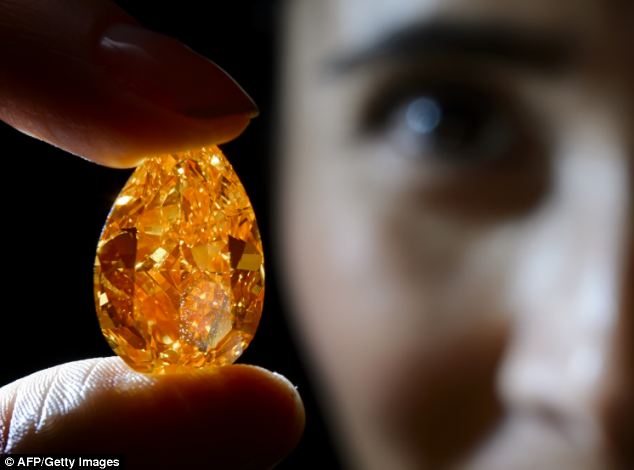 Rare orange diamond sold at auction for £22million - PHOTO