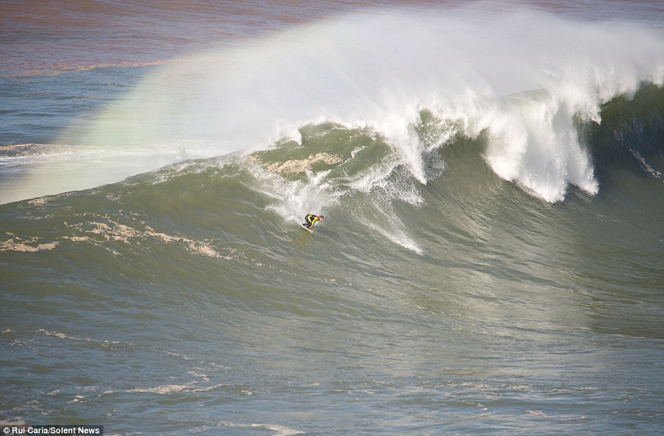 Thrill-seeker surfs through incredible waves