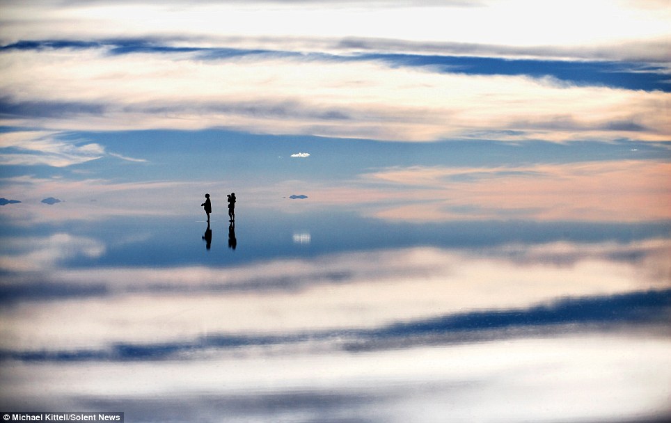Skylines reflected in water create a dream-like background - PHOTO