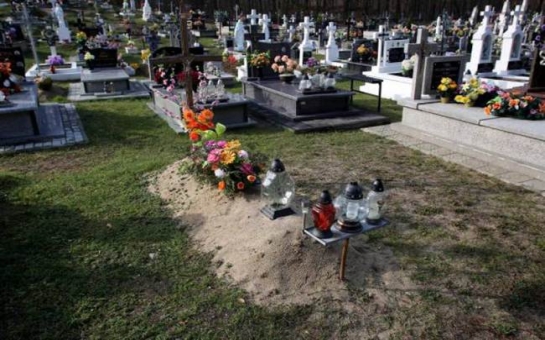 Man returns home to find parents laying flowers at his grave