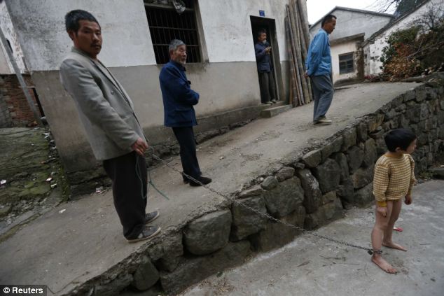 Young boy with mental illness is chained up by his relatives - PHOTO