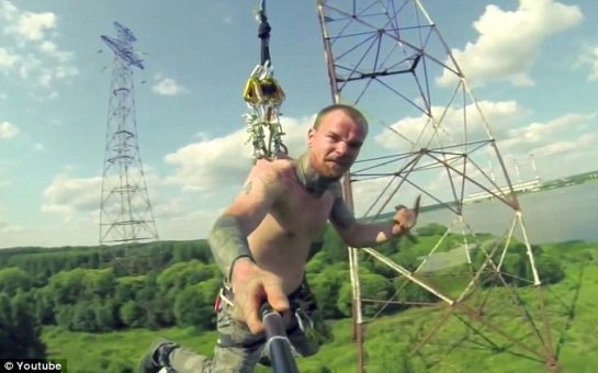 Extreme bungee jumpers attach metal hooks on harness to their skin - PHOTO