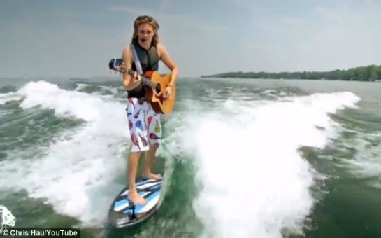 Musician who can play his guitar while riding his surfboard