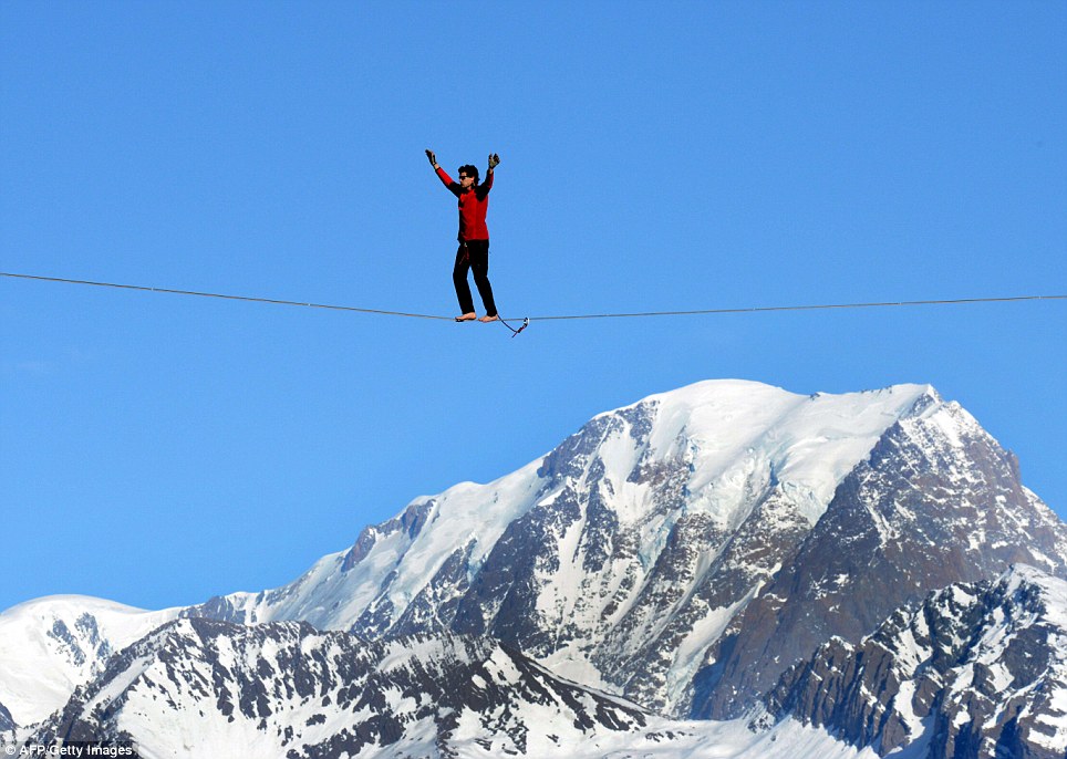 Daredevil highliner performs walk 1,200ft above the Alps - PHOTO