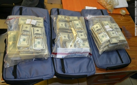 Police find $7.2 million cash stashed in suitcases