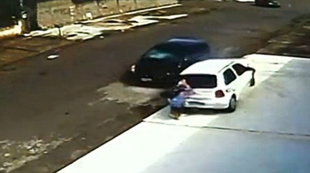 Incredible footage shows the moment car goes over a five-year-old's HEAD - PHOTO+VIDEO