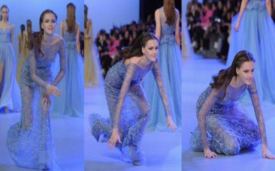 Model takes a tumble as she sashays down the catwalk - VIDEO