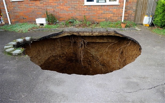 Sinkhole opens up yards from family's home