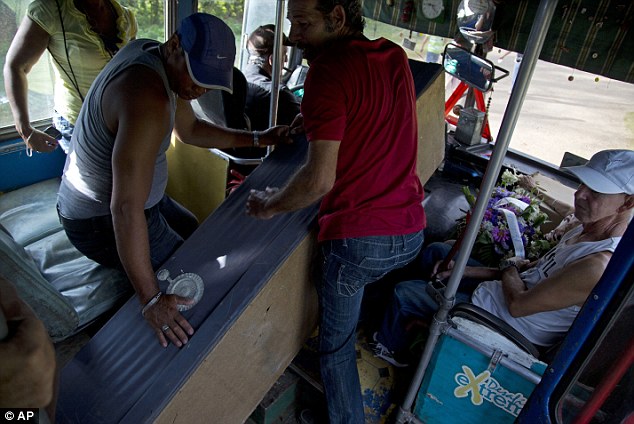 Cubans 'bury' man alive in bizarre village festival - PHOTO