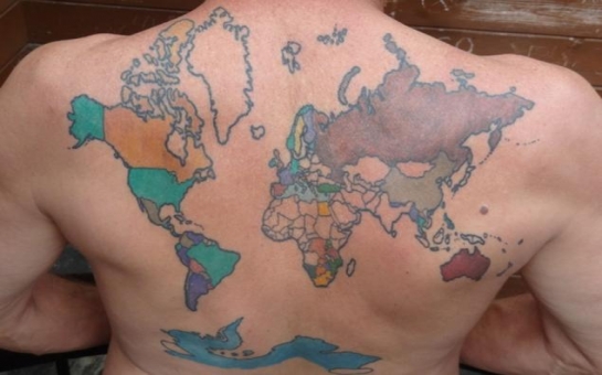 Lawyer tattoos world map on back, colors in countries he visits
