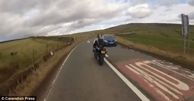 Heart-stopping moment 60mph motorcyclist plunges 40ft off a CLIFF - PHOTO+VIDEO