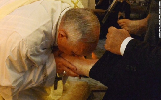 Pope Francis washes the feet of disabled people