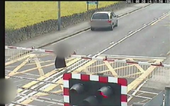 Moment a pensioner is hit by a train on a level crossing - VIDEO