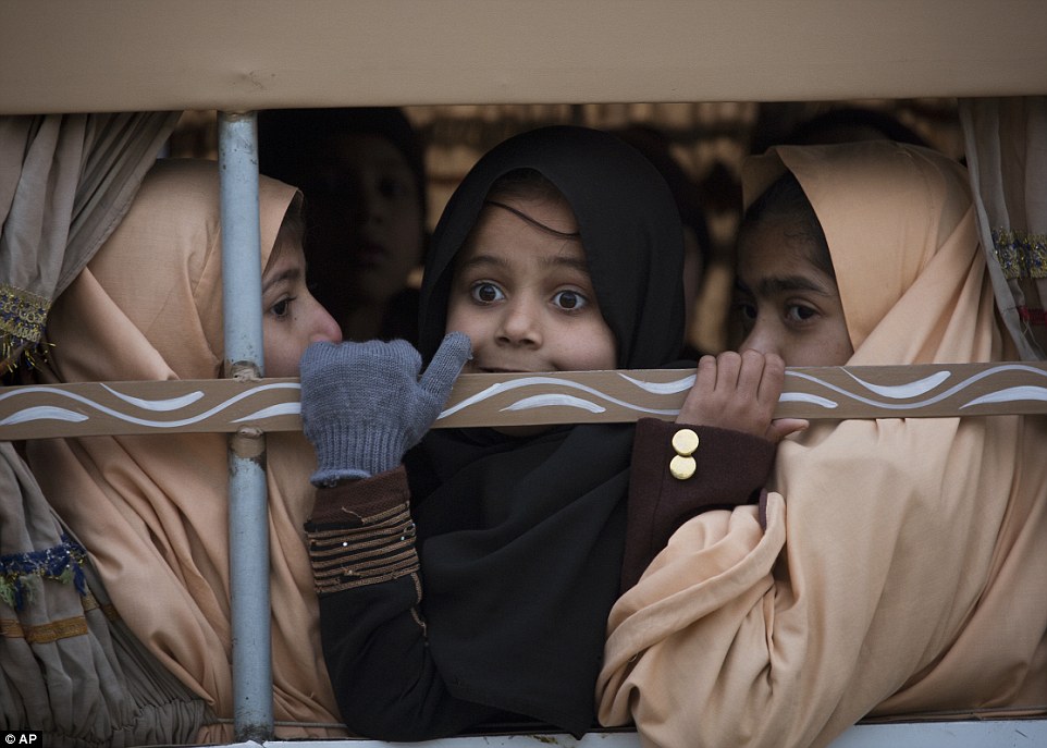 Pakistani school return to the scene where 133 of their classmates were slaughtered