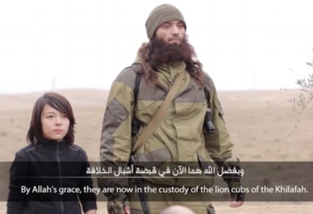ISIS release new footage claiming to show a child executing two Russian 'spies'