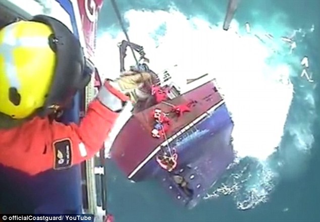 Dramatic footage shows moment fishermen cling