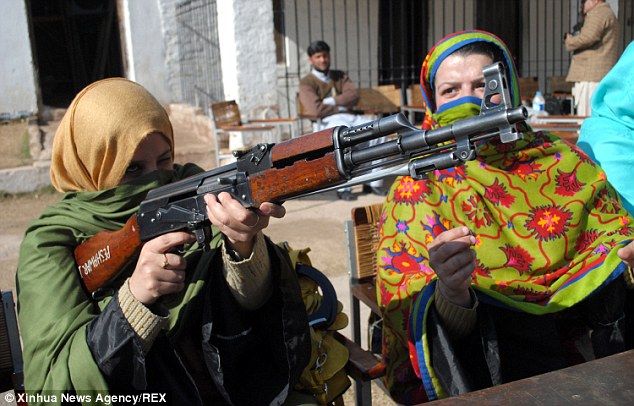 Women trained to use Kalashnikovs and handguns… to defend their CLASSROOMS