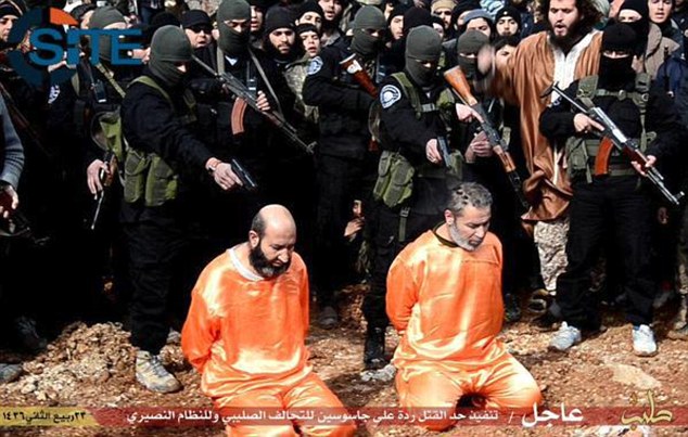 ISIS publicly executes two 'spies' and CRUCIFIES another