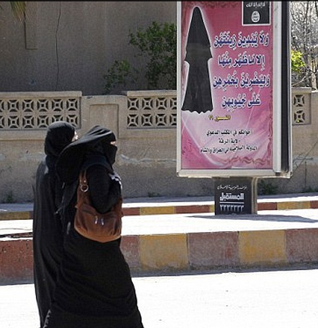 ISIS morality police arrest a woman wearing full burkha and face veil