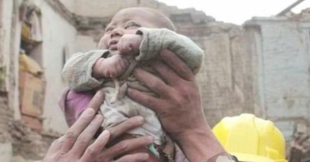 Incredible moment four-month-old baby is pulled ALIVE from the rubble