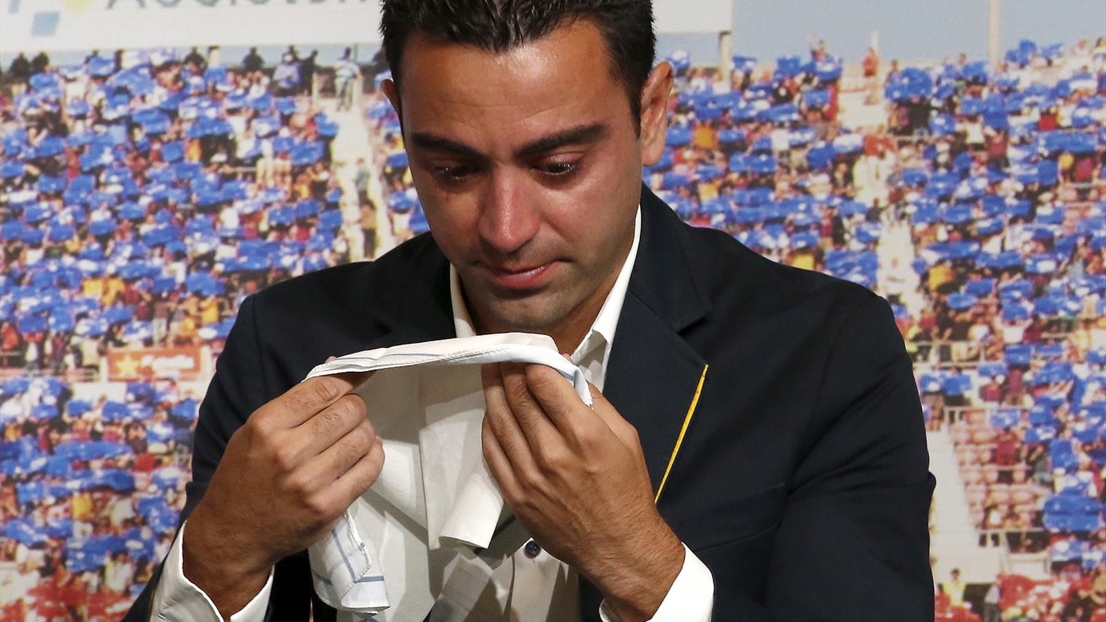 Barcelona's Xavi weeps during farewell tribute