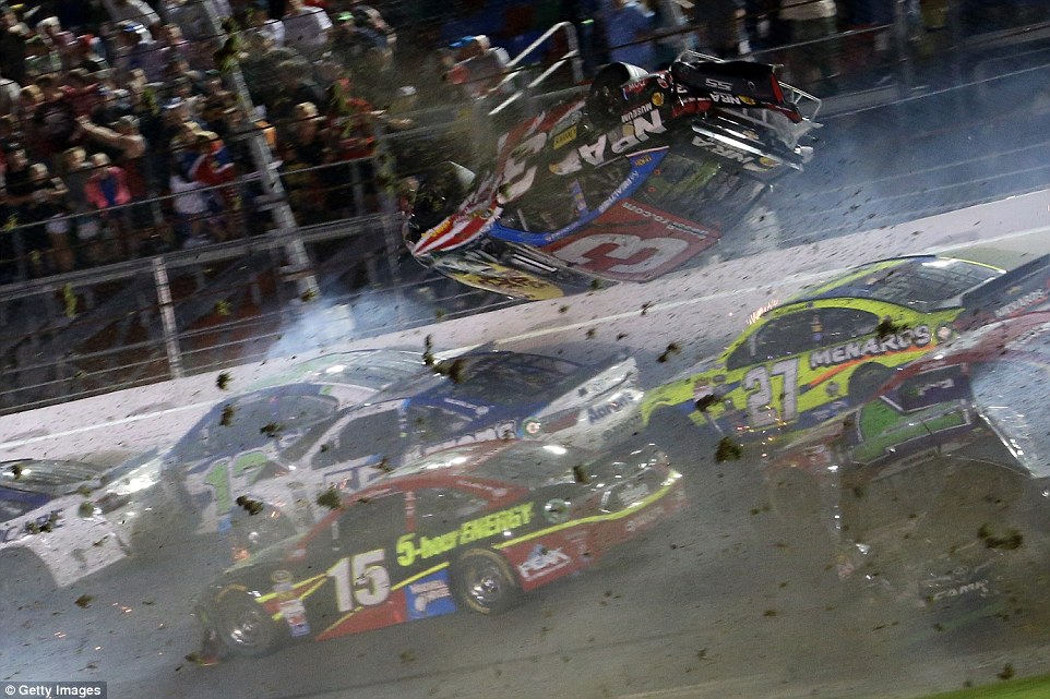 NASCAR driver flips over racetrack before smashing into fence at 200mph