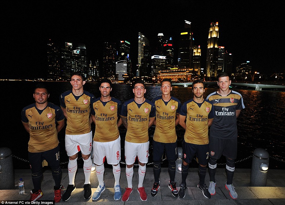 Arsenal release new gold and navy away strip at Singapore kit launch