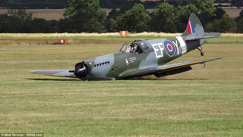 Incredible moment a pilot landed his Spitfire without any WHEELS