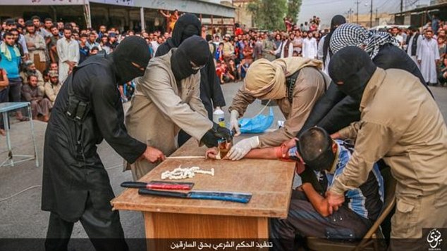 ISIS thugs chop off suspected robber's hand