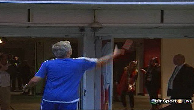 Mourinho throws his Community Shield runners-up medal to a young Arsenal fan