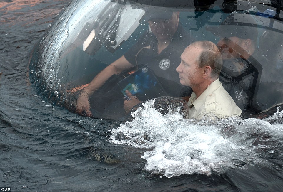 Putin takes control of a research submarine in the Black Sea in latest bizarre stunt