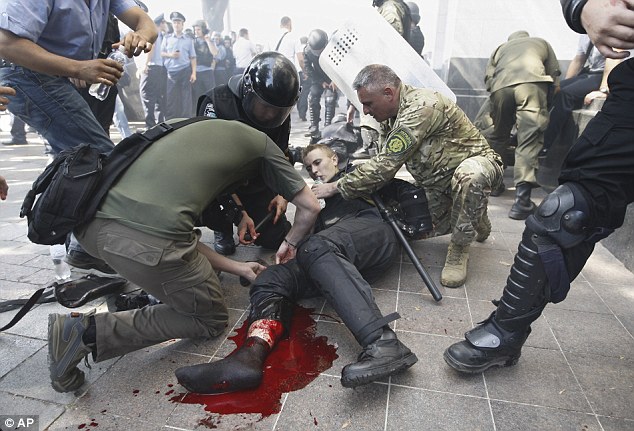 Policeman dies, 100 injured after grenade explodes outside Ukraine parliament