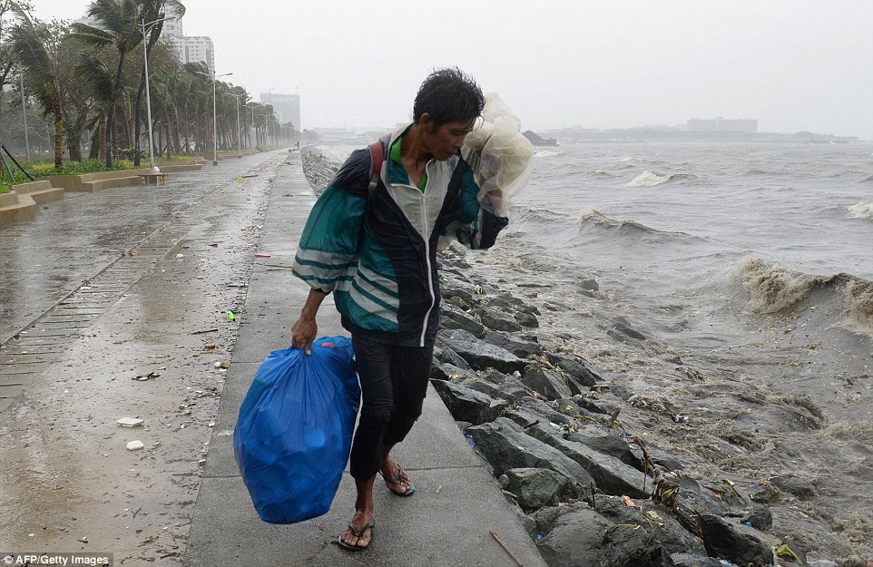 Typhoon ploughs into Philippines killing two people and leaving 23,000 more without homes
