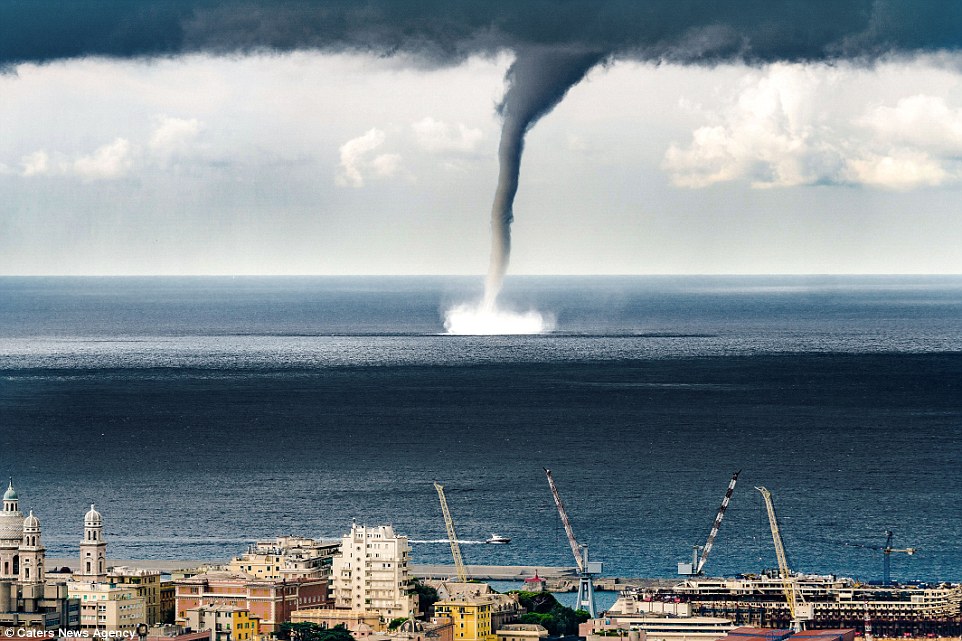 Incredible moment a massive waterspout descended on Italian coastal town