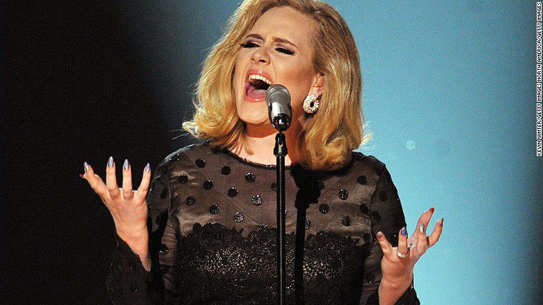 Adele big winner at BRIT Awards as industry pays tearful tribute to Bowie