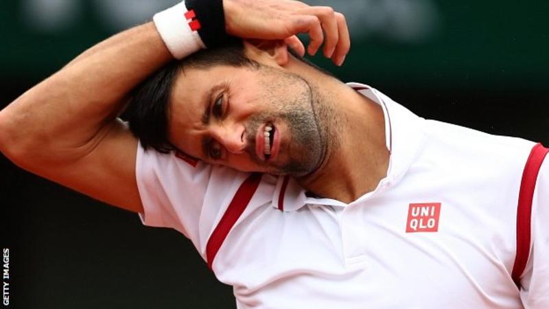 Novak Djokovic leads Roberto Bautista Agut when rain returns