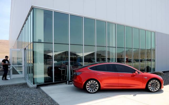 Tesla posts another loss, but says on track for future deliveries