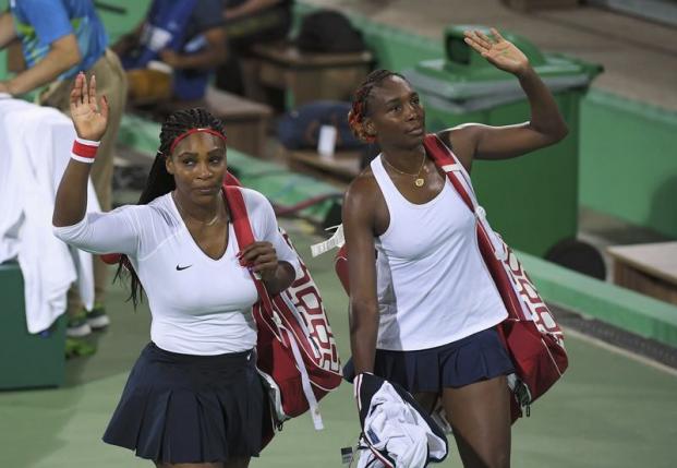 Tennis: Williams sisters crash out of doubles