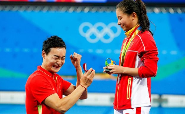 A marriage proposal at the Olympics medal ceremony
